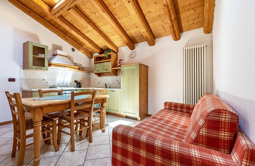 Ronzo-Chienis Appartement | Appartement de vacances "Agritur Piazera Attico" avec vue sur la montagne
