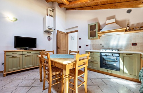 Ronzo-Chienis Appartement | Appartement de vacances "Agritur Piazera Attico" avec vue sur la montagne