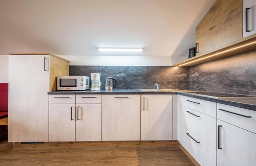 Maranza Appartement | Appartement de vacances "Résidence Condor Schlern" avec vue sur les montagnes, sauna et jardin