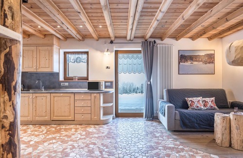 Bedollo Maison | Maison de vacances "Baita Nonno Ghino" avec vue sur les montagnes, jardin et Wi-Fi.
