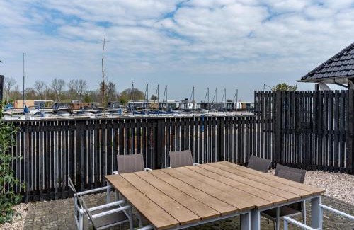 Offingawier Maison | Holiday Home in Sneek with Waterfront Jetty