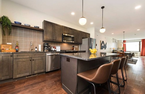 Central Northside Maison | ★ HostWise Stays ★ 3 King Beds! Garage! Theater! Great Location!