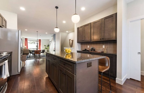 Central Northside Maison | ★ HostWise Stays ★ 3 King Beds! Garage! Theater! Great Location!
