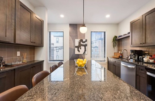 Central Northside Maison | ★ HostWise Stays ★ 3 King Beds! Garage! Theater! Great Location!