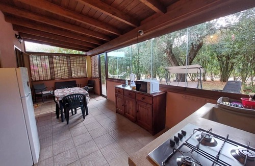 Iglesias Historic Centre Appartement | House The Ancient Olive Tree, nestled in a centuries-old olive grove with a large garden around it.