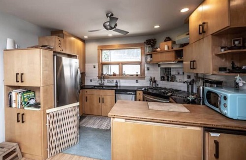 Holland Maison | Hygge Hideaway with gas fireplace, fenced yard, and eco friendly products