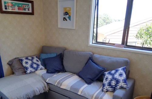 Red Beach Cabine | Iconic Kiwi Bach with sea views and a 2 minute walk to the beach.
