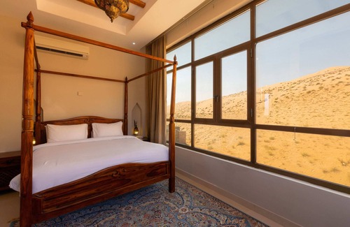 Bidiya Station Balnéaire | Immerse in ultimate desert elegance with the Sand Suite at Thousand Nights Camp