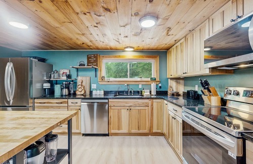 South Casco Maison | Inviting lakefront home with private dock, sandy beach, and stunning views