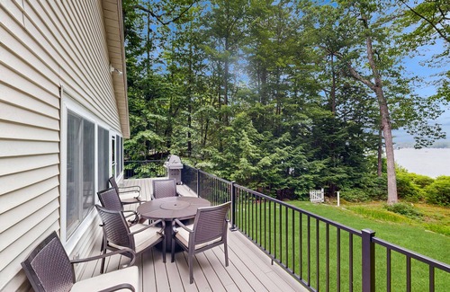 South Casco Maison | Inviting lakefront home with private dock, sandy beach, and stunning views