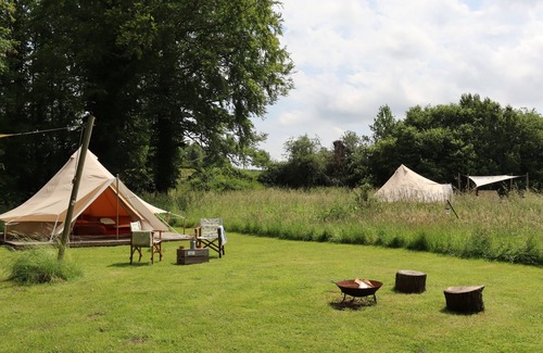 Swannington Cabine | Iris, Lilypad and Bulrush are luxury bell tents all set privately in a wild meadow.