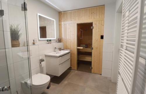 Tossens Appartement | KÜSTE33/24 – Exklusive Ferienwohnung mit Sauna & nah am Strand!