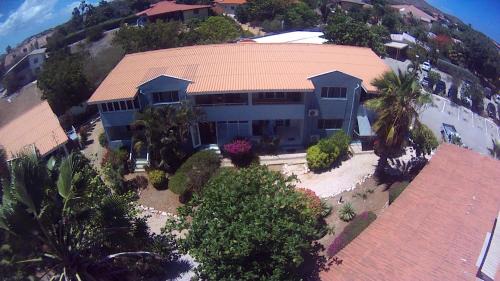 Willemstad Appartement | Kas di BaMi A-194 op Seru Coral Resort - Ruim appartement met groot zwembad en tropische tuin