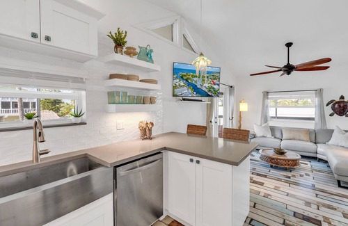 Twin Lakes Maison | Key Largo Canalfront Home w/Boat Lift, Swim Spa, Tiki Hut & Game Room