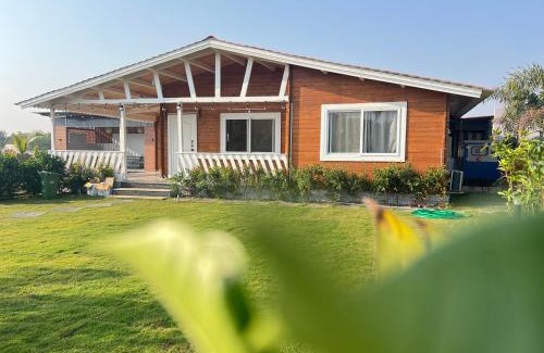 Chevella Chalet De Ski | Kuku farm stay 3 bedroom wooden cottage with private pool at Moinabad