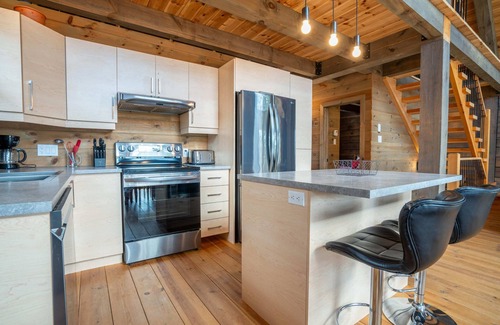 Mauricie Maison | L'Inukshuk | Chalet en bois ave Spa |