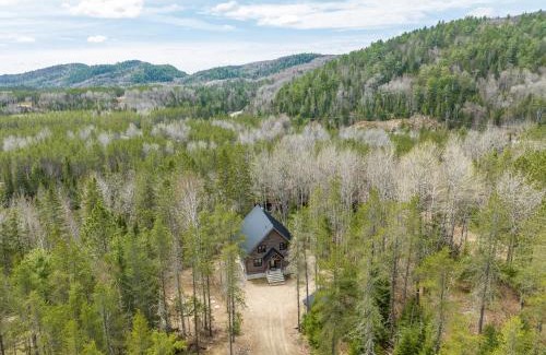 Mauricie Maison | L'Inukshuk - Chalet en bois ave Spa