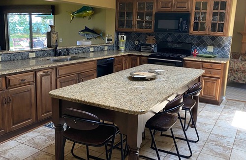 Irving Maison | Lake Front Home. Private stairs to private beach and bay. upscale 5 bedroom home