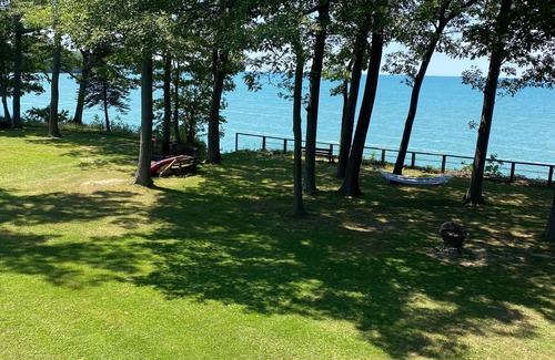 Irving Maison | Lake Front Home. Private stairs to private beach and bay. upscale 5 bedroom home