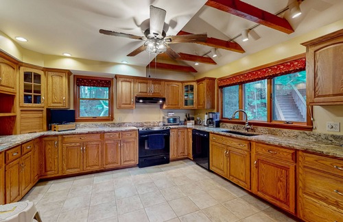 Raymond Maison | Lakefront home with amazing sunrise & sunset views, game tables & water toys