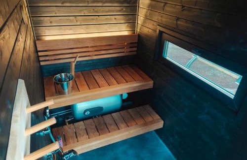 Kolari Chalet De Ski | Lapland Riverside Cabin 5 MUSTIKKA, Ylläs, Tiny Home with Sauna, Fireplace, Terrace, BBQ, Wifi, Ski, Fishing, Pets OK