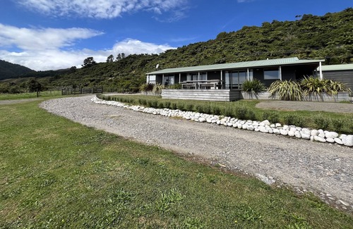Mokihinui Maison | Large home with stunning sunset views.