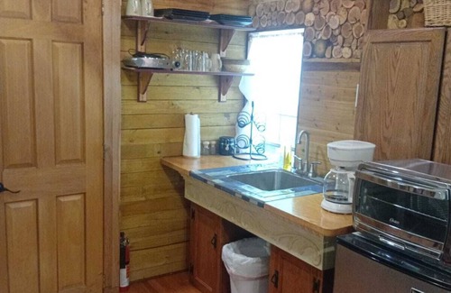 Athens Cabine | Laurentius' Cabin on a Koi Pond