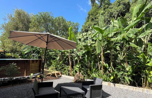 Cafeiere Cottage | Les Vanilles Gite in lush tropical setting, swimming pool 800m from the beach.