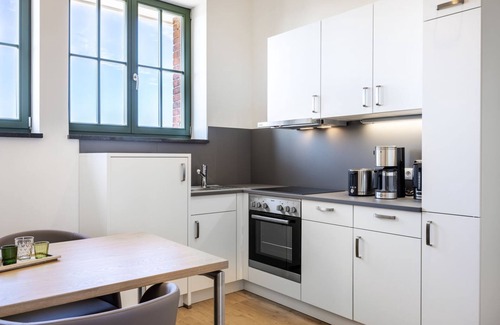 Wismar Appartement | Light-flooded harbor apartment with panoramic view, roof terrace and balcony - Krusespeicher