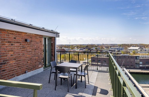 Wismar Appartement | Light-flooded harbor apartment with panoramic view, roof terrace and balcony - Krusespeicher
