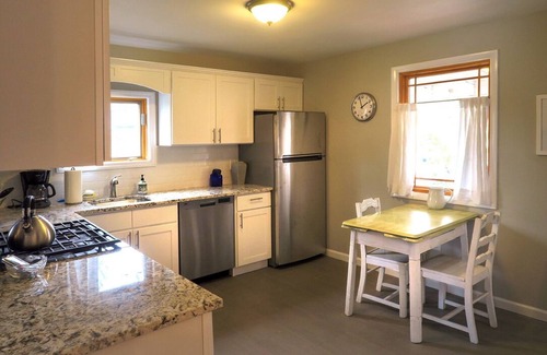 Riverhead Maison | Light rippling on river, private dock, nature preserve beyond