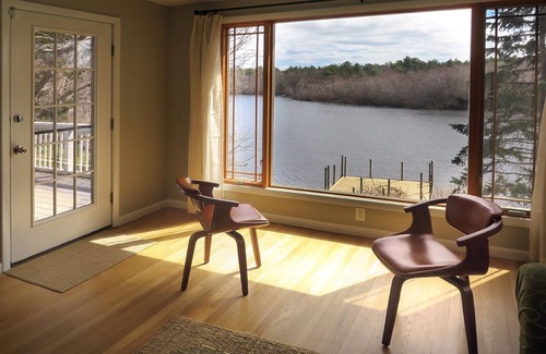 Riverhead Maison | Light rippling on river, private dock, nature preserve beyond