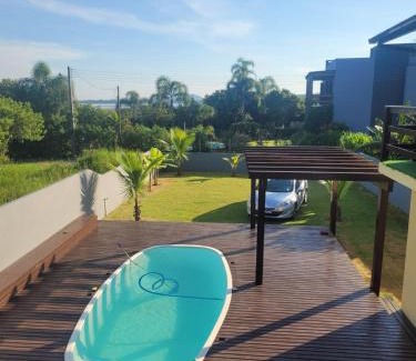 Ibiraquera Maison | LINDA CASA COM PISCINA DE FRENTE PARA A LAGOA