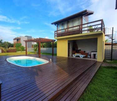 Ibiraquera Maison | LINDA CASA COM PISCINA DE FRENTE PARA A LAGOA