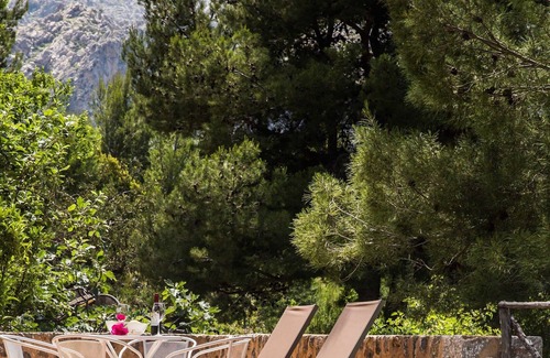 Escorca Maison | Petite maison à Cala Tuent avec vue sur la mer et les montagnes. Piscine privée et WIFI gratuit.