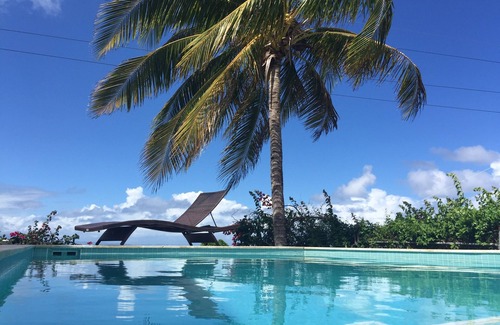 Villa Borinquen Villa | Piscine, vue panoramique sur l'océan et 5 minutes à pied de la plage!