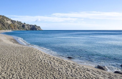 Scilla Appartement | Look forward to a beautiful view of the sea in this beachfront vacation rental.