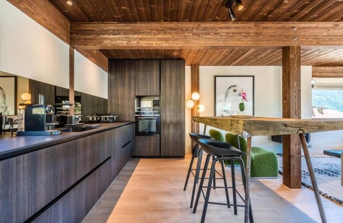 La Cote-d'Arbroz Chalet De Ski | Lovely wooden balconies, a swing chair with the most picturesque view