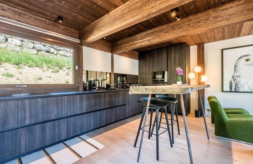 La Cote-d'Arbroz Chalet De Ski | Lovely wooden balconies, a swing chair with the most picturesque view