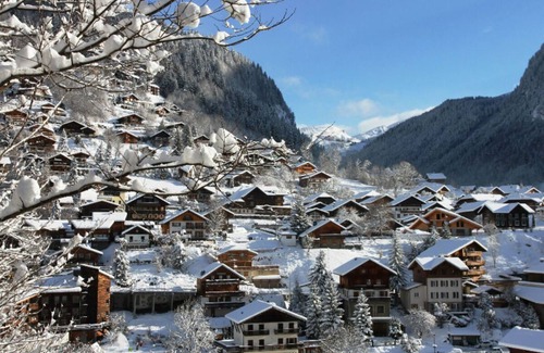 La Cote-d'Arbroz Chalet De Ski | Lovely wooden balconies, a swing chair with the most picturesque view