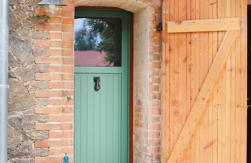 Klosterdorf Maison | Lovingly restored fieldstone barn with fireplace and woodchip heating.