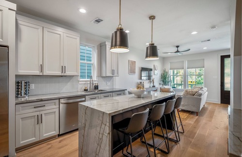 Galveston Maison | Lux Ocean Escape: Walk to Beach, Backyard Oasis, King Bed, Bunks & Hot Tub!