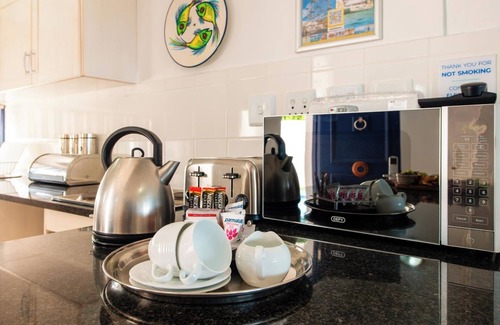 Mykonos Appartement | Luxe Beachside Retreat | Patio | Resort Perks