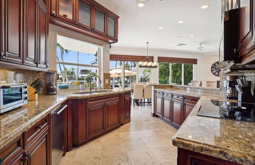 Tropic Isle Maison | Luxurious Delray Beach Waterfront Pool Home w/ outdoor kitchen & hot tub!
