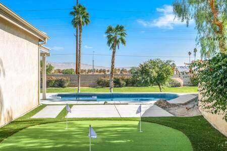 Indio Maison | Luxurious Getaway Near Coachella Stagecoach Pool Putting Green Parking Firepit Sleeps 11