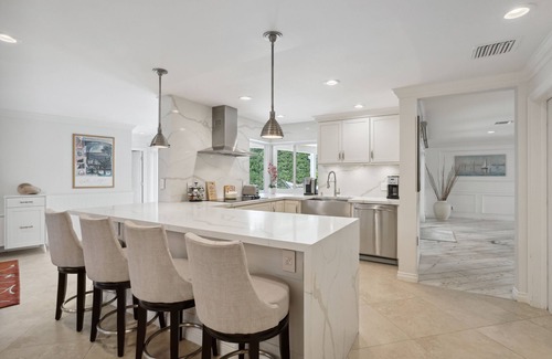 Tropic Isle Maison | Spanish Trail Waterfront Oasis - Luxurious Single Story Home in Delray Beach!