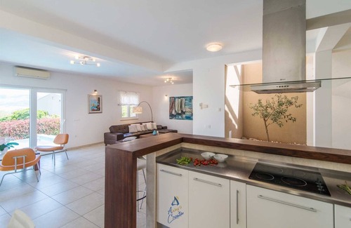 Mirce Villa | Luxury 6-BR Waterfront Villa with Infinity Pool and direct access to a pebble beach