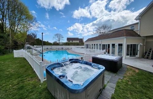 East Patchogue Villa | Elegant Villa Retreat w/ Heated Saltwater Pool, 2 Hot Tubs, & Entertainment