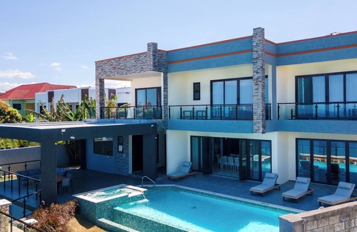 Epworth Villa | Luxury Oceanfront Villa~ Fully Staffed~Pool~Jacuzzi~Movie Theatre