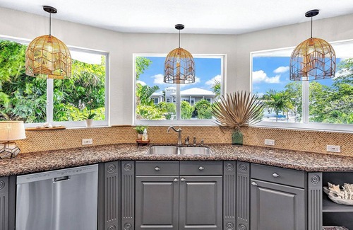 Twin Lakes Maison | Luxury Water Front Home, Private Pool, Spa, Tiki Bar, 36' Foot Dock with Kayaks